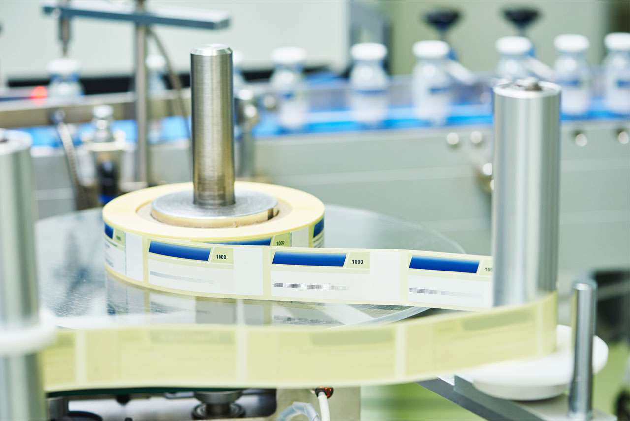 A pharm primary packaging, labeling, and serialization assembly line.