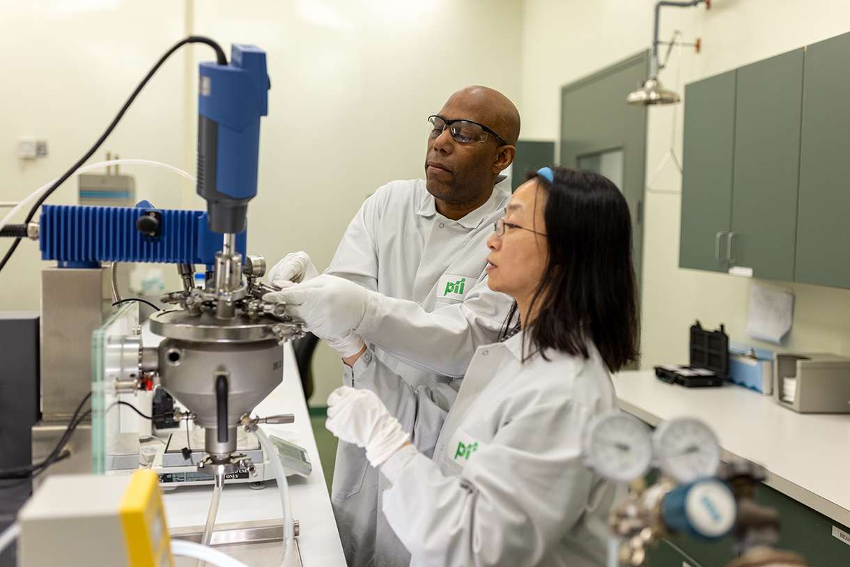 Pii scientists performing physical-functional testing for viscosity.